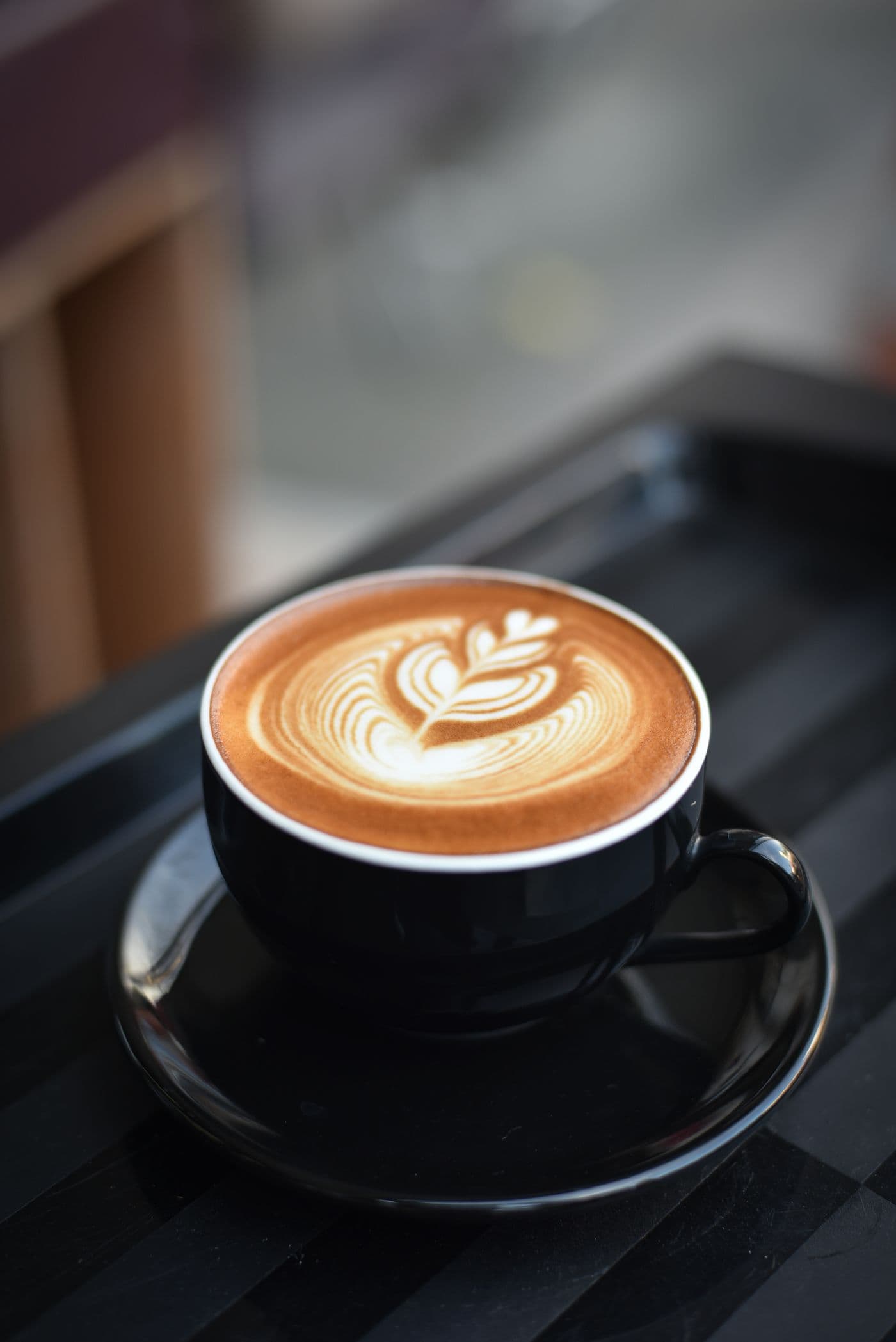 Stock photograph of a latte with leaf-shaped foam art